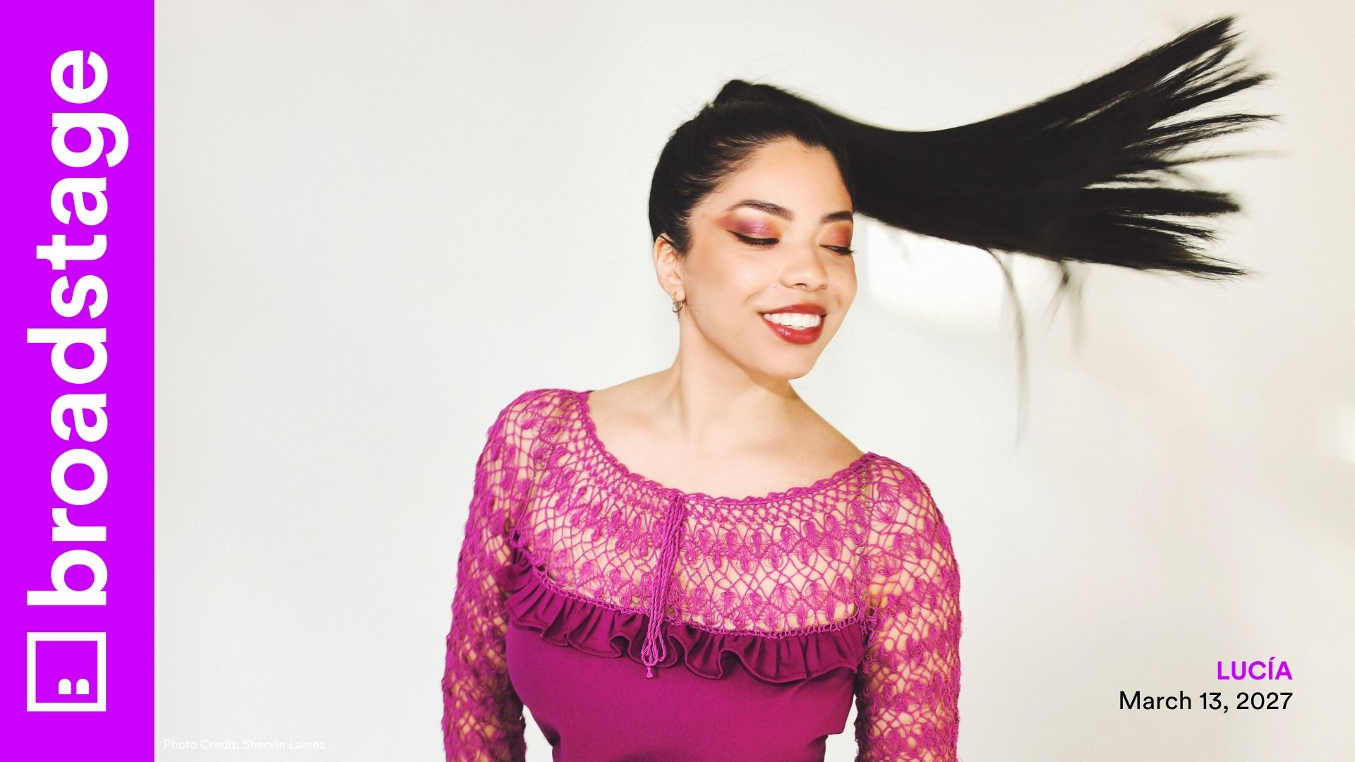 A smiling woman tosses her long hair mid-swing, wearing a magenta lace top. BroadStage branding and event details appear on the sides.