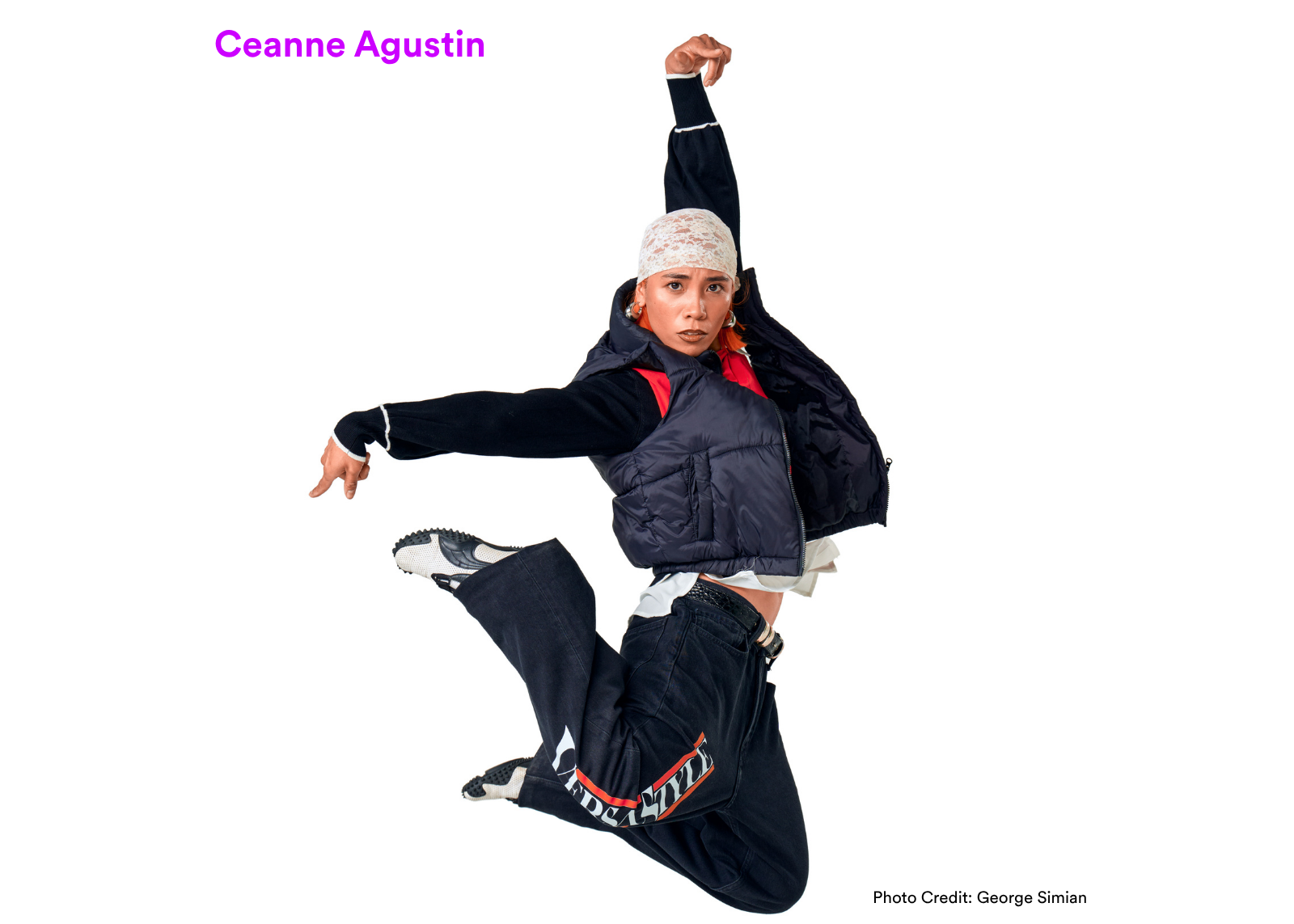 Dancer Ceanne Agustin leaps with one arm raised and legs tucked, wearing a black puffer vest and lace head covering. Photo: George Simian.